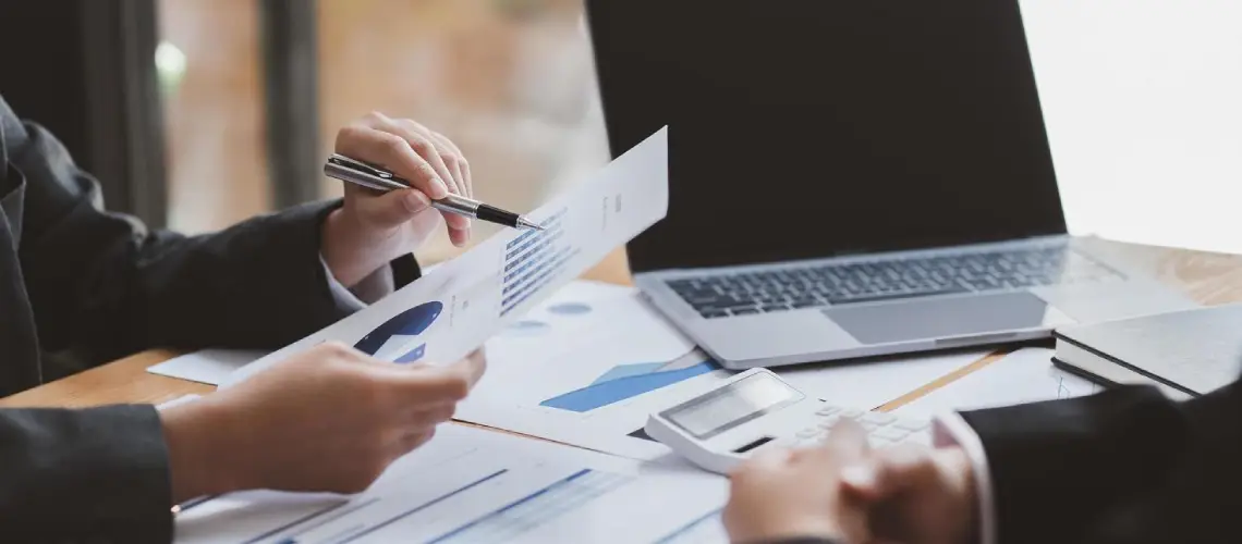 A business professional in Canberra discussing valuation methods with a financial consultant